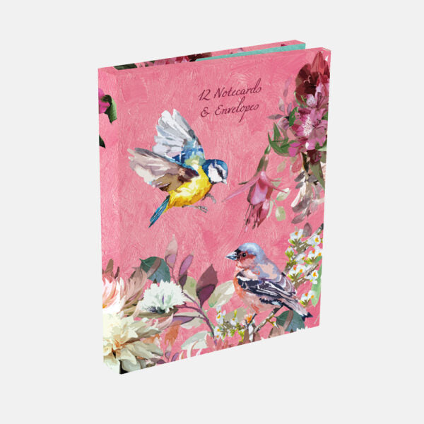 Notebook with bird and floral design on a pink background