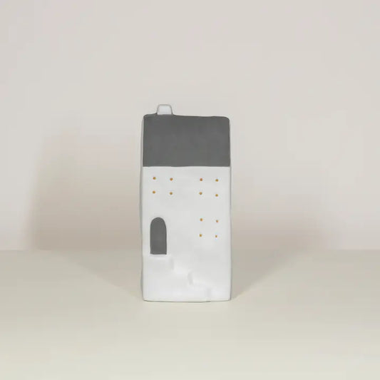 Rectangular tall LED house with gray top and white bottom on a beige background