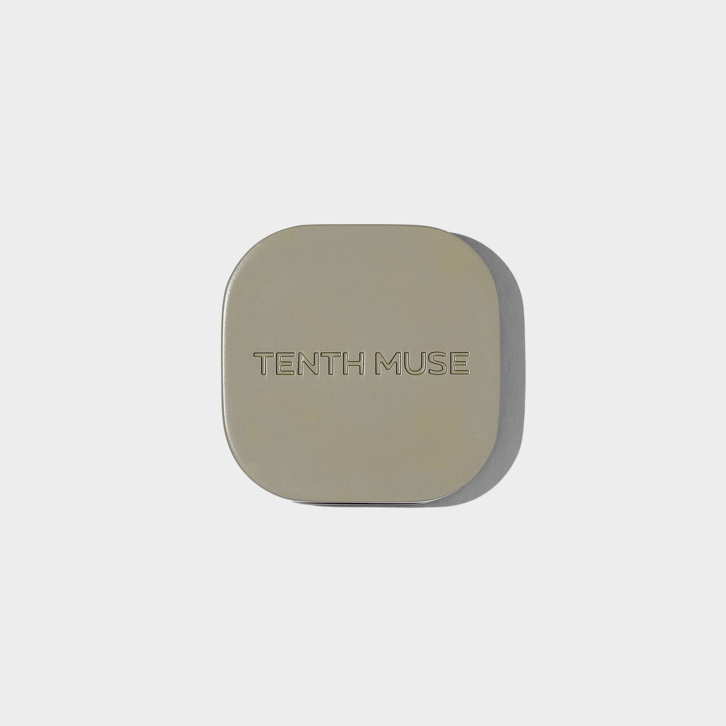 Square compact with 'Tenth Muse' branding on a light gray background