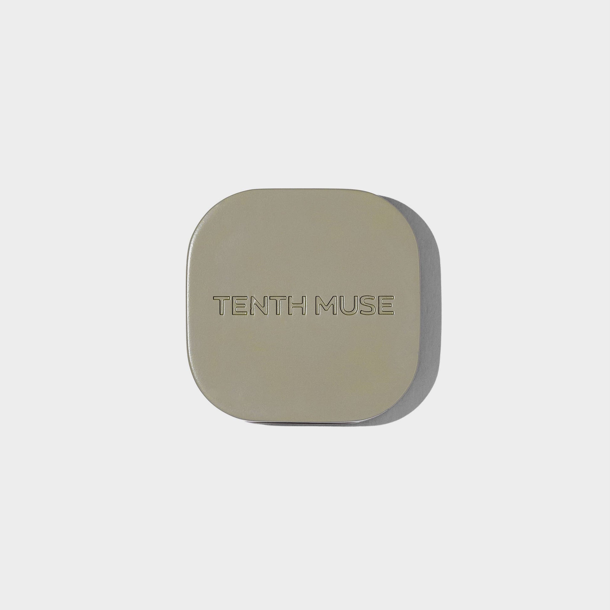 Square compact with 'Tenth Muse' branding on a light gray background