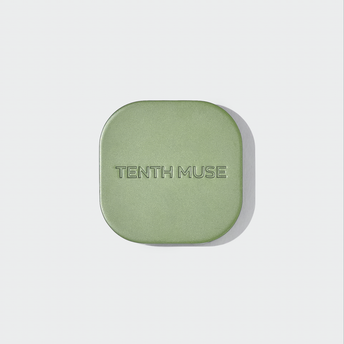Green perfume case with 'Tenth Muse' branding on a light gray background