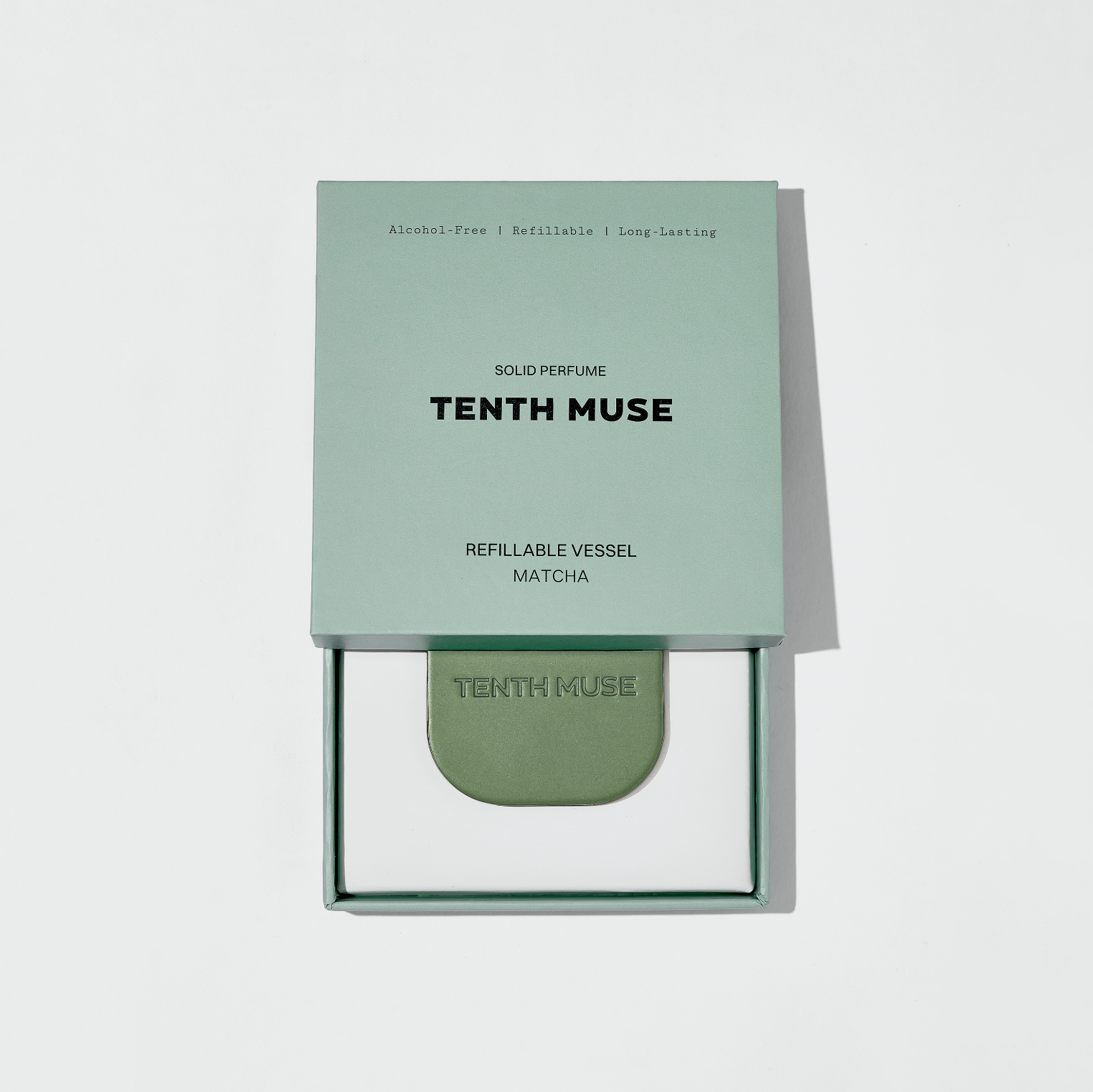 Tenth Muse solid perfume packaging on a light gray background