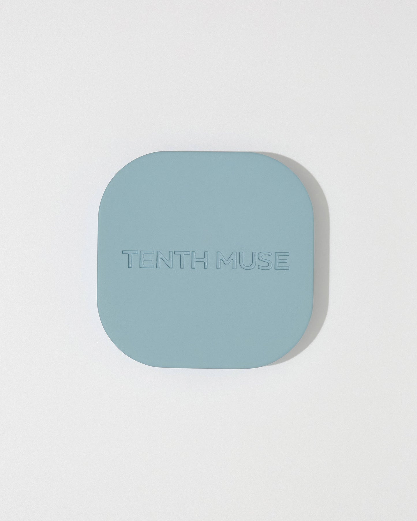  Tenth Muse metal perfume balm holder  on a light gray background