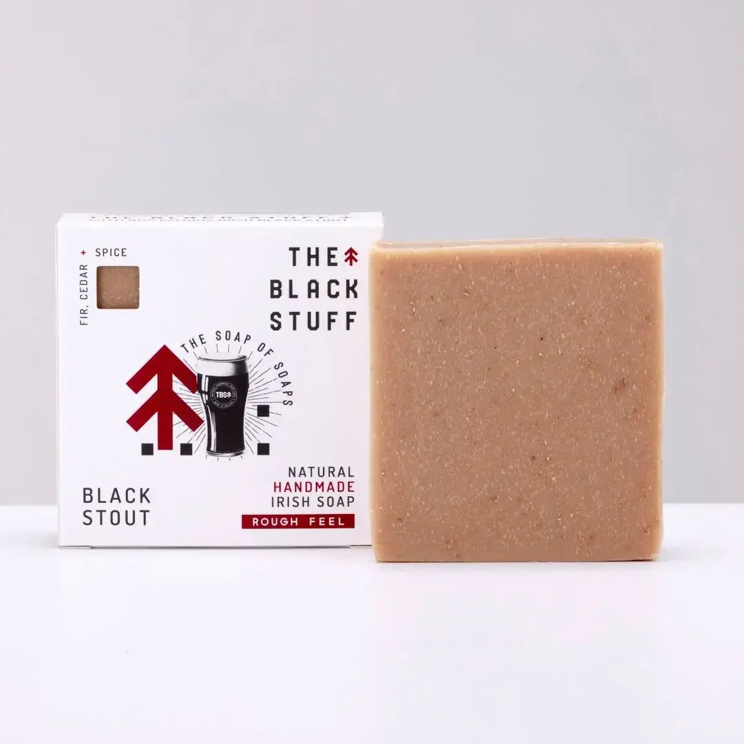 Packaged bar of Black Stout soap with branding and product information on the packaging.