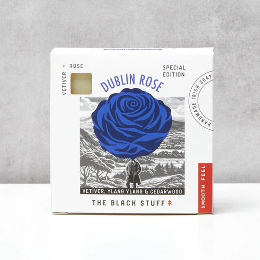 The Black Stuff Dublin Rose.Soap packaging with blue rose design on a gray background