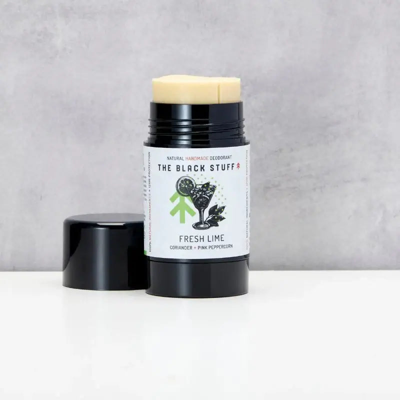A stick deodorant with a black lid and label that reads 'fresh lime' with an illustration of a lime and leaves. The deodorant is vegan friendly and cruelty free.