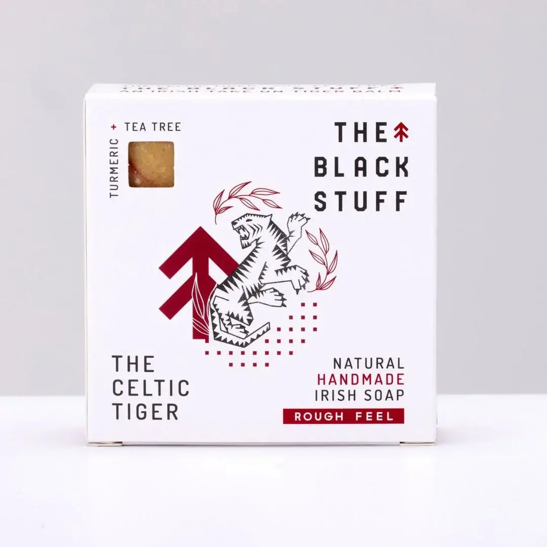 Packaging of 'The Celtic Tiger' soap by The Black Stuff, featuring a white and red design with the product name, an image of a tiger, and the scent marked as Tiger Balm, Menthol & Tea Tree.