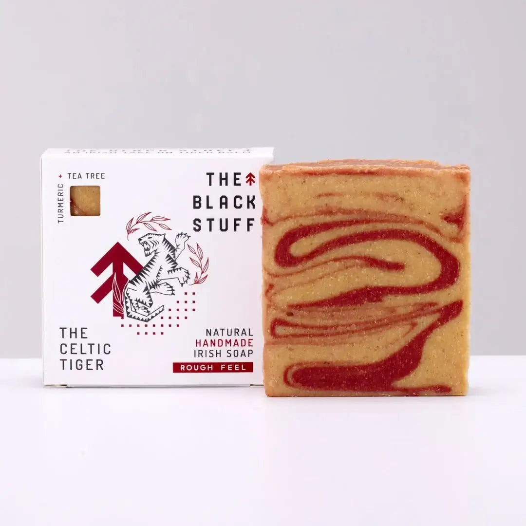 Packaging of 'The Celtic Tiger' soap by The Black Stuff, featuring a white and red design with the product name, an image of a tiger, and the scent marked as Tiger Balm, Menthol & Tea Tree.