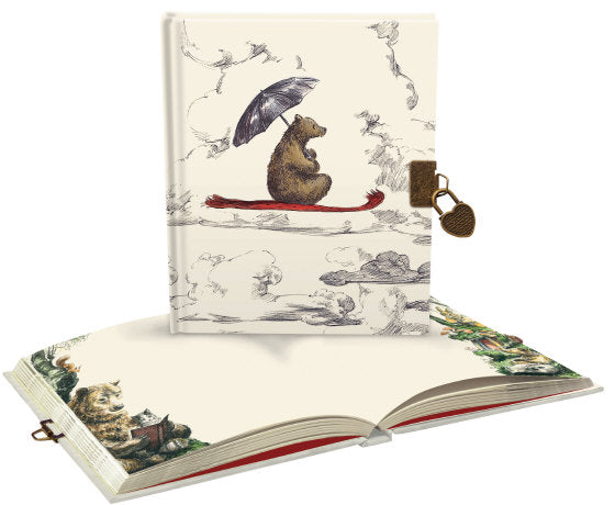 Decorative notebook with a bear illustration on the cover, open to reveal detailed interior pages.