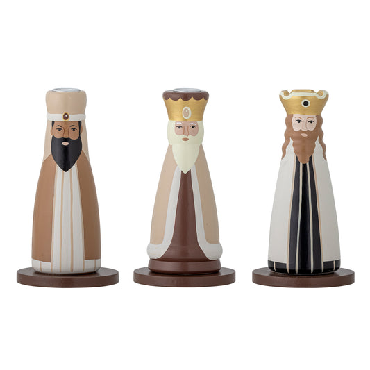 Three wise men painted candle holders on a white background
