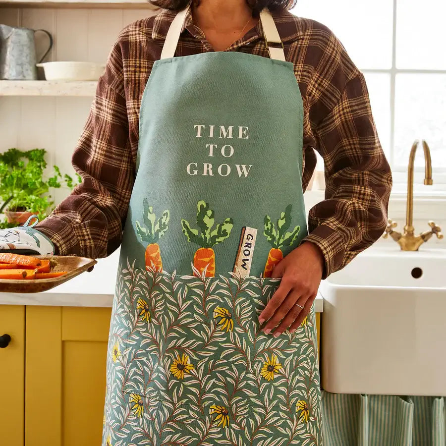 Woman wearing Time to Grow Cotton Apron