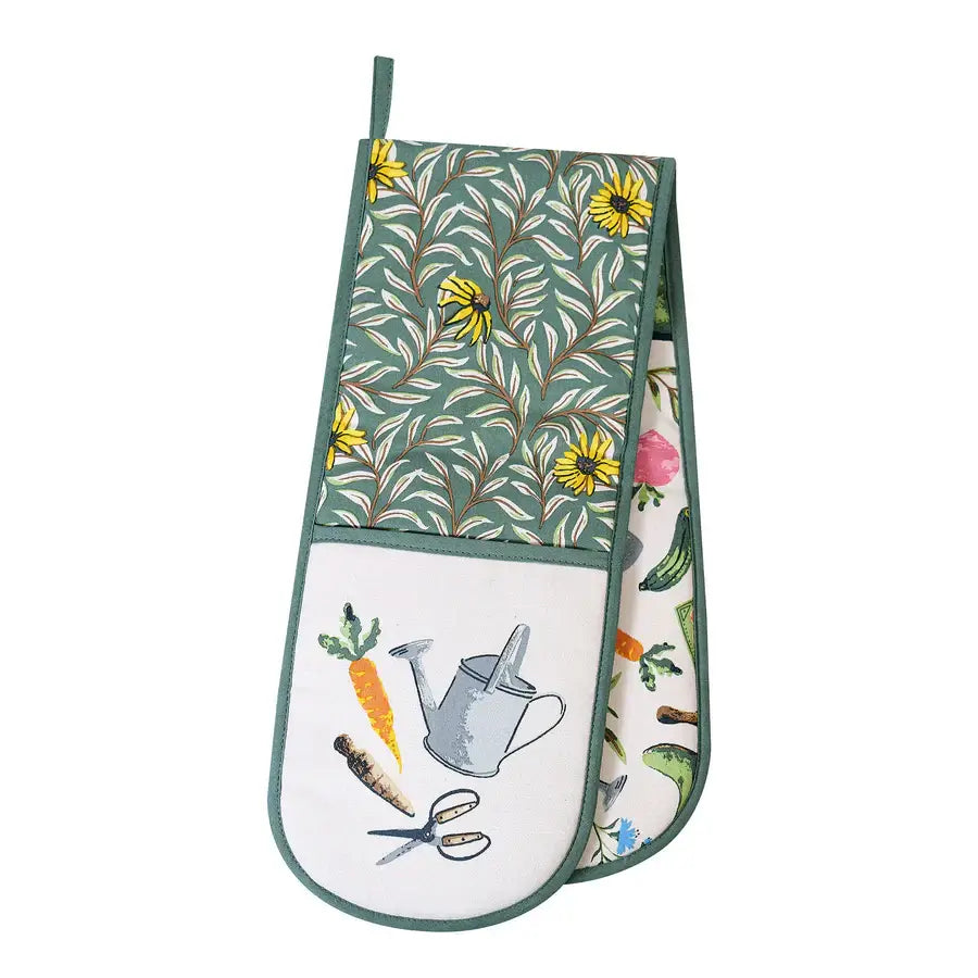 Floral-patterned oven mitt with gardening-themed design on a white background