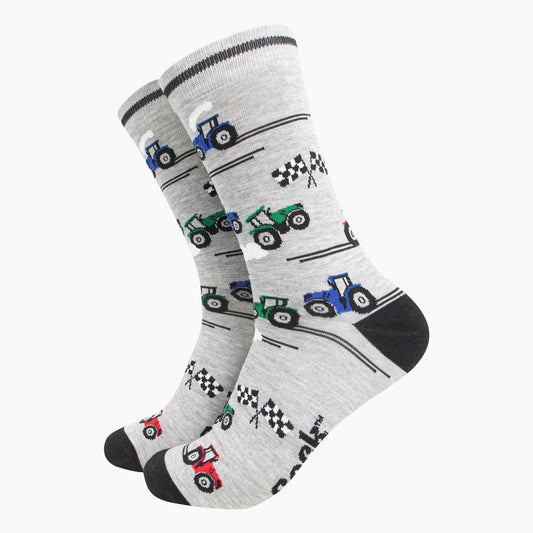 Gray socks with tractor pattern on a white background
