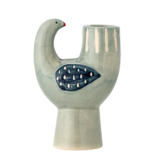 A stoneware candle holder shaped like a small bird with a blue glaze and hand-painted details.