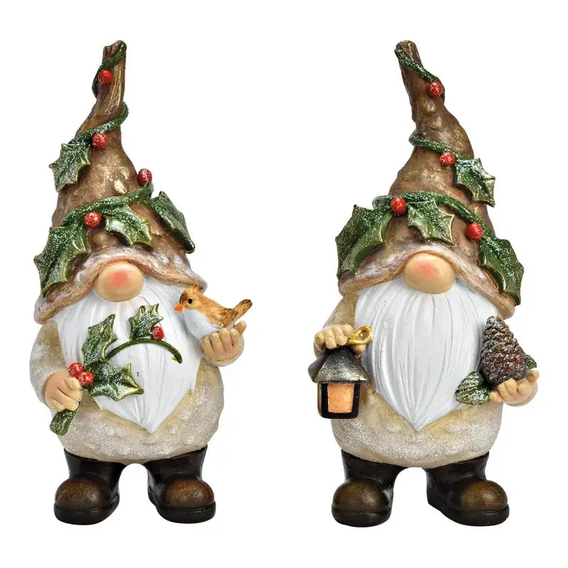 Two festive gnomes with winter decorations on a white background