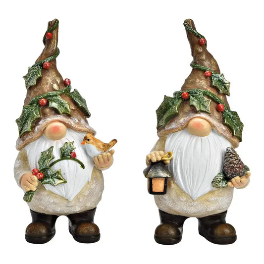 Two festive gnomes with winter decorations on a white background
