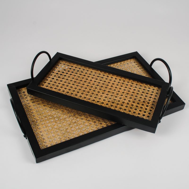Two black trays with woven surfaces on a light gray background