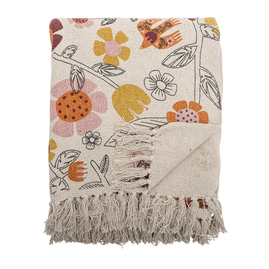Floral patterned throw blanket with fringes on a white background