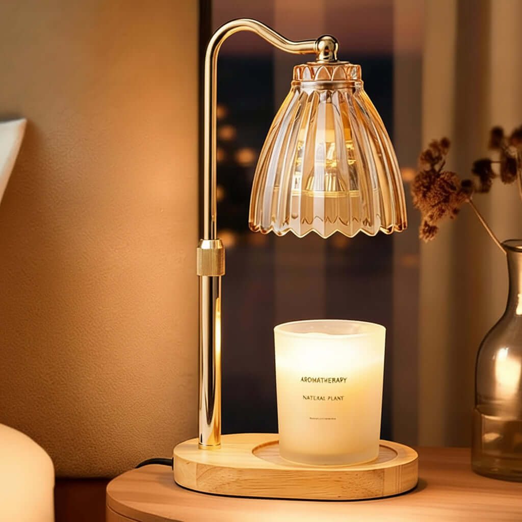 Decorative table lamp with a candle on a wooden base in a warm setting.