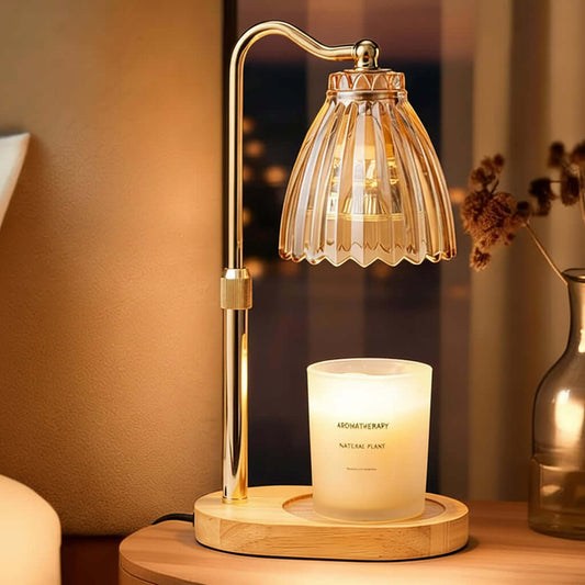 Decorative table lamp with a candle on a wooden base in a warm setting.