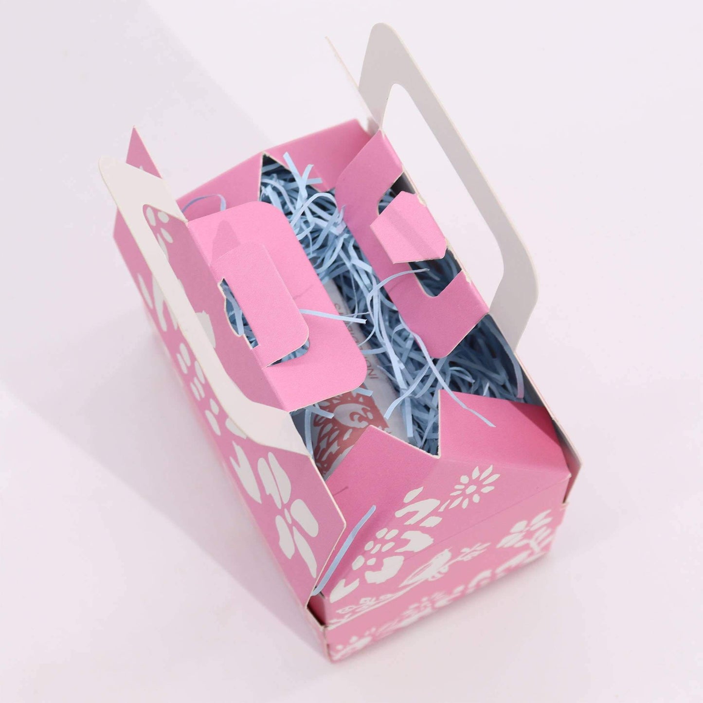 Wellness gift set open from the top. Blue issue paper on view inside