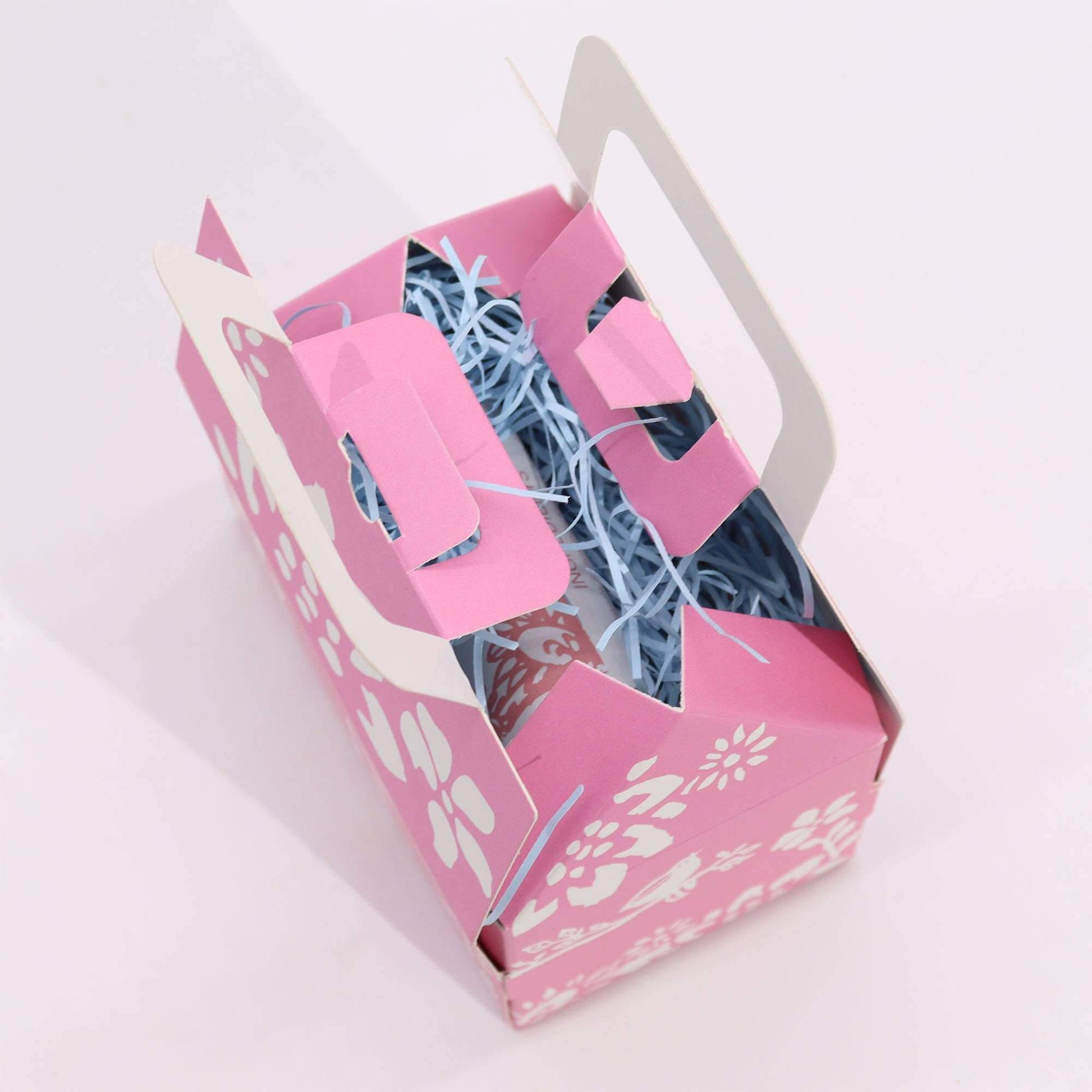 Wellness gift set open from the top. Blue issue paper on view inside