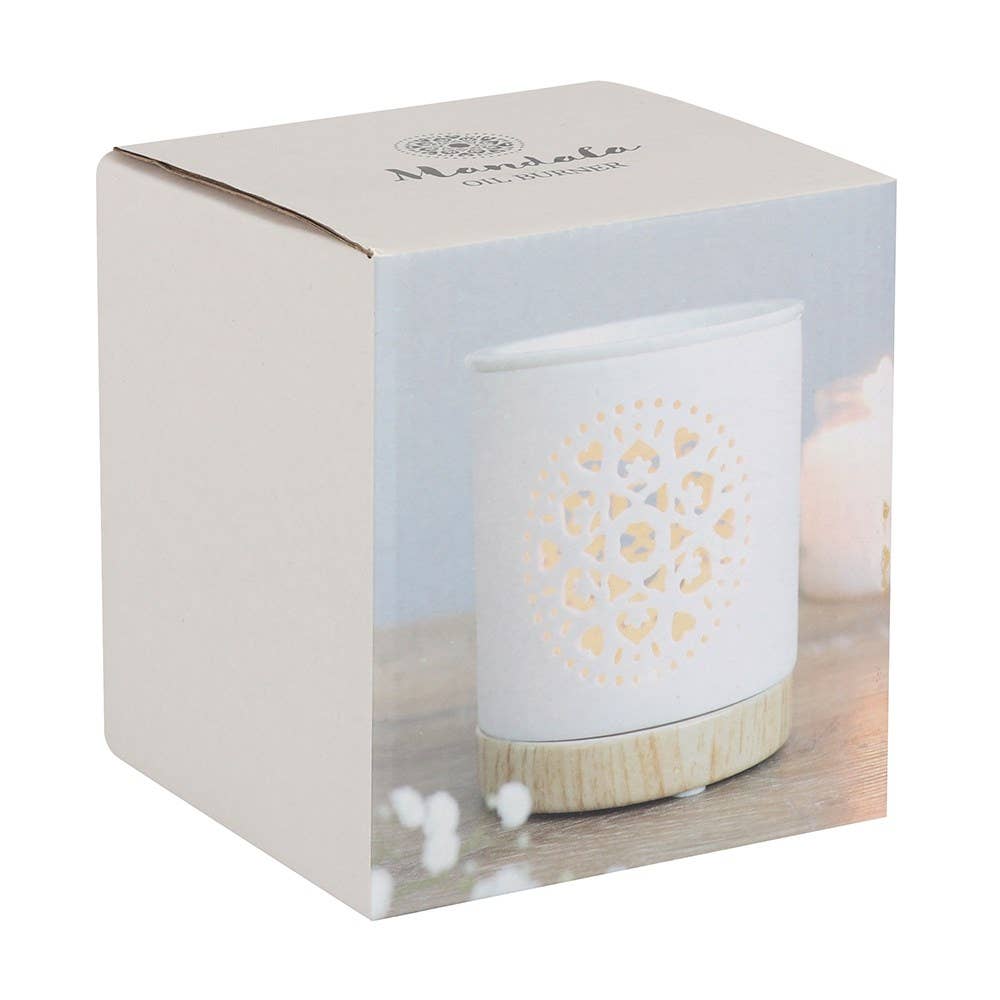 White ceramic diffuser with wooden base in a decorative box on a white background