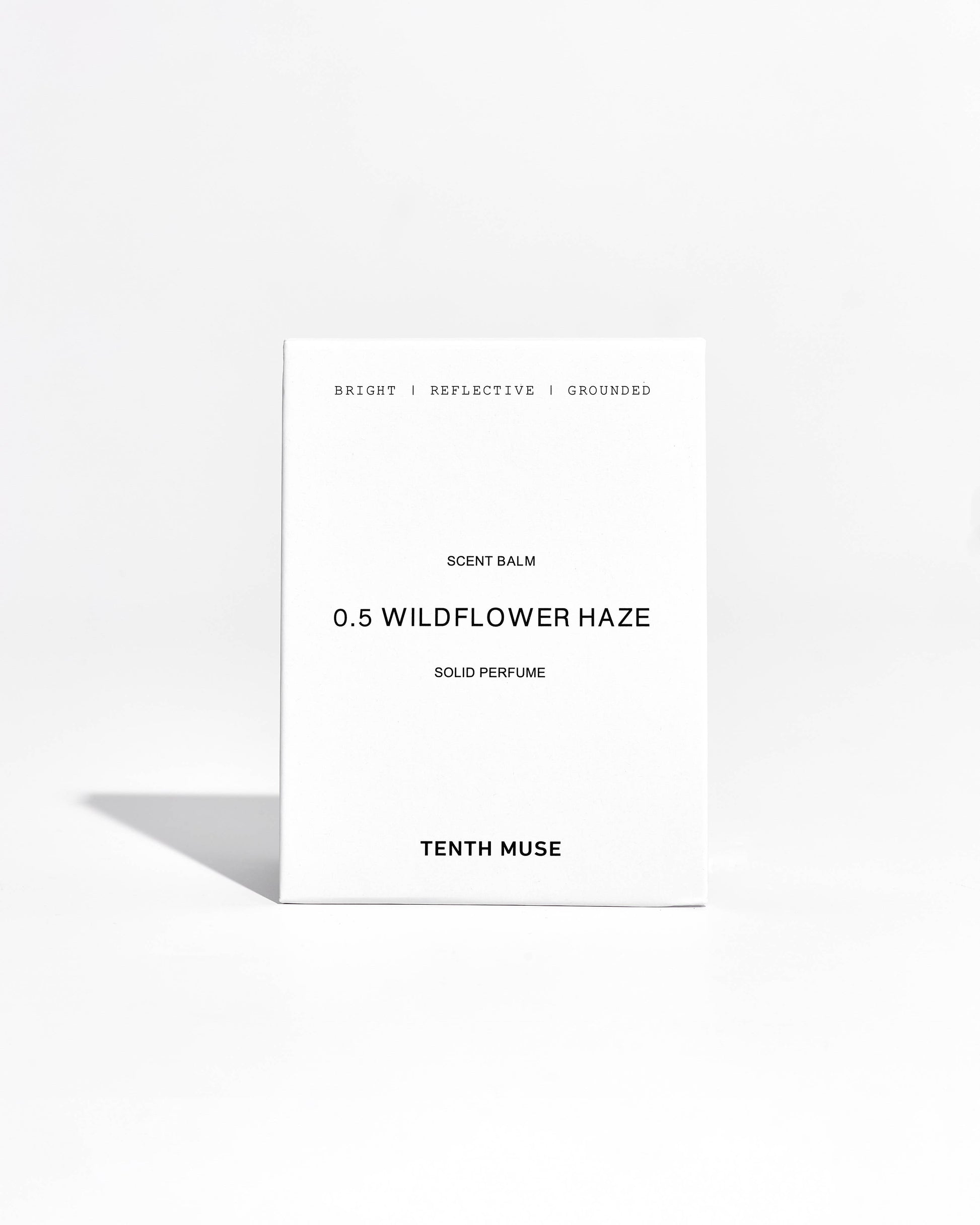Tenth Muse Wildflower Haze solid perfume packaging on a white background