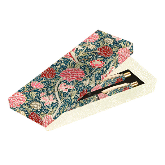 Floral-patterned box with pens on a white background
