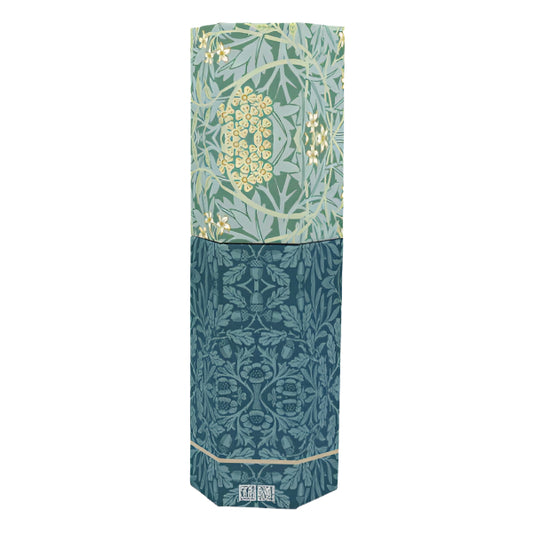 Teal and green patterned box with floral design on a white background