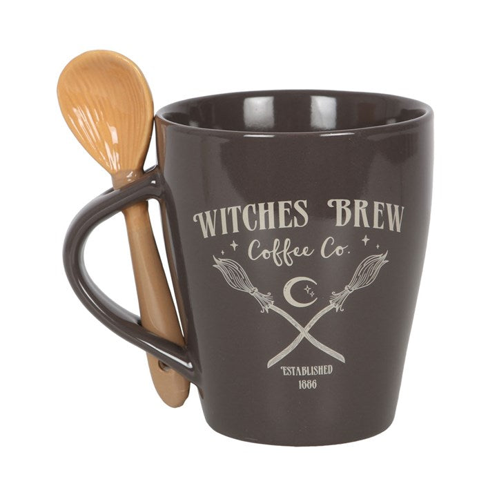 Brown mug with 'Witches Brew Coffee Co.' text and wooden spoon on a white background