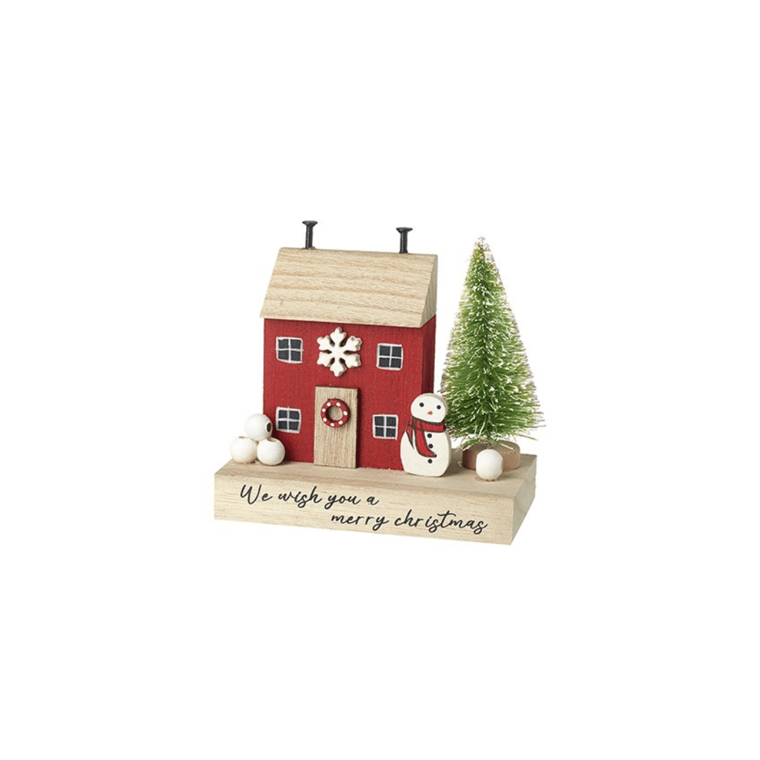 A small Christmas house decoration with a red body, light wood roof and base, a green tree, a snowman, and white ornaments on a white background.