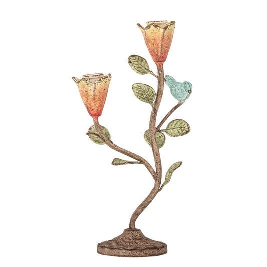 Decorative candle holder with floral design on a white background