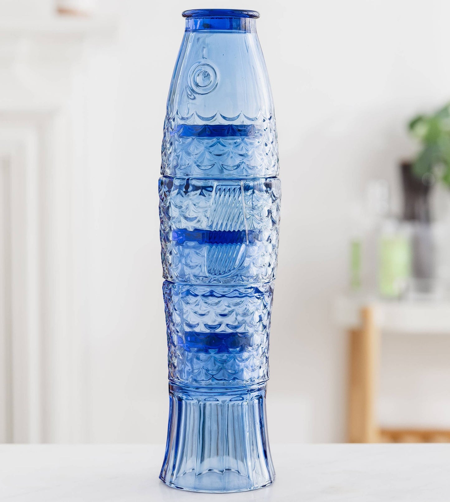 Fish Stacking Drinking Glass - Set of 4 Blue on a table