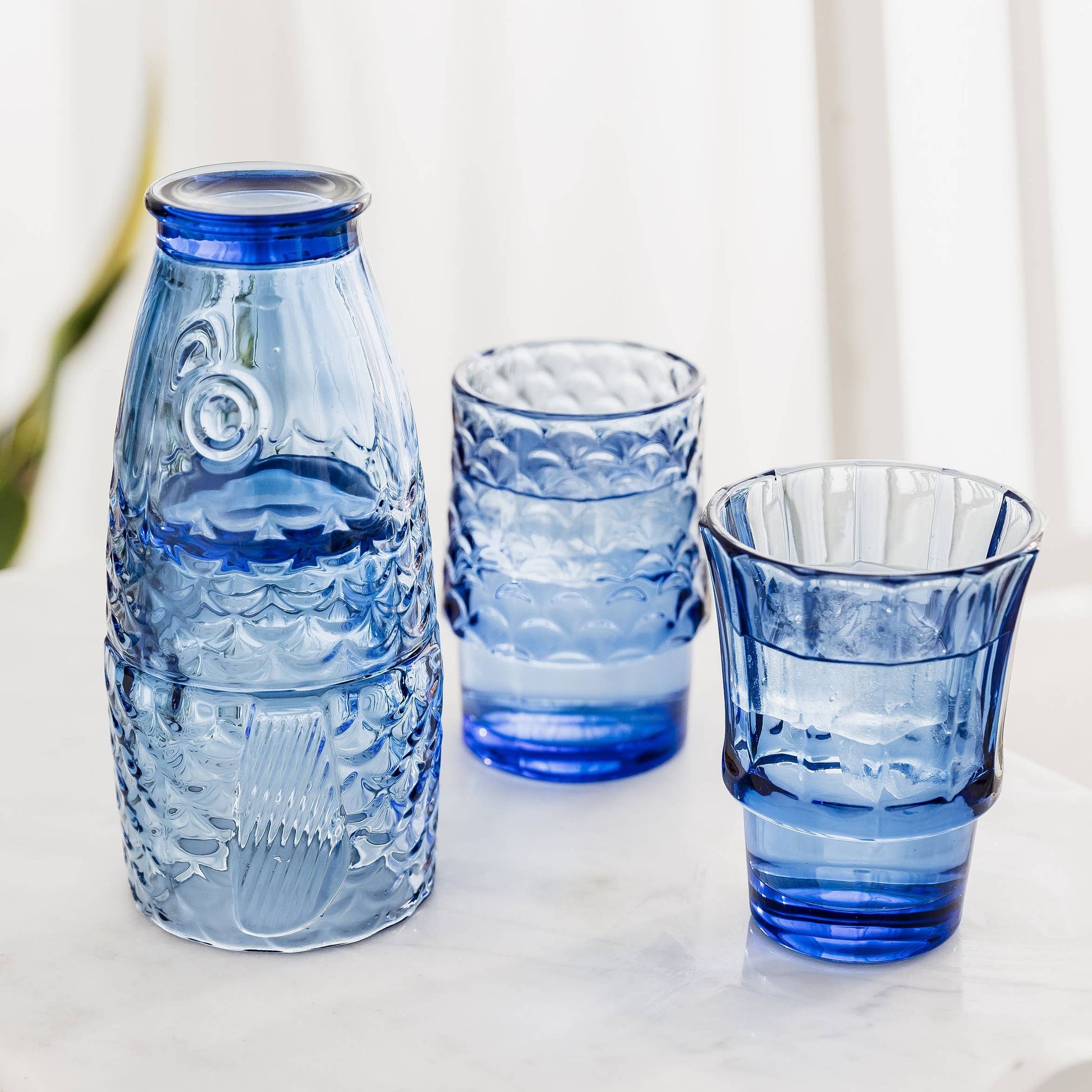 Blue - Fish Stacking Drinking Glass open on a table