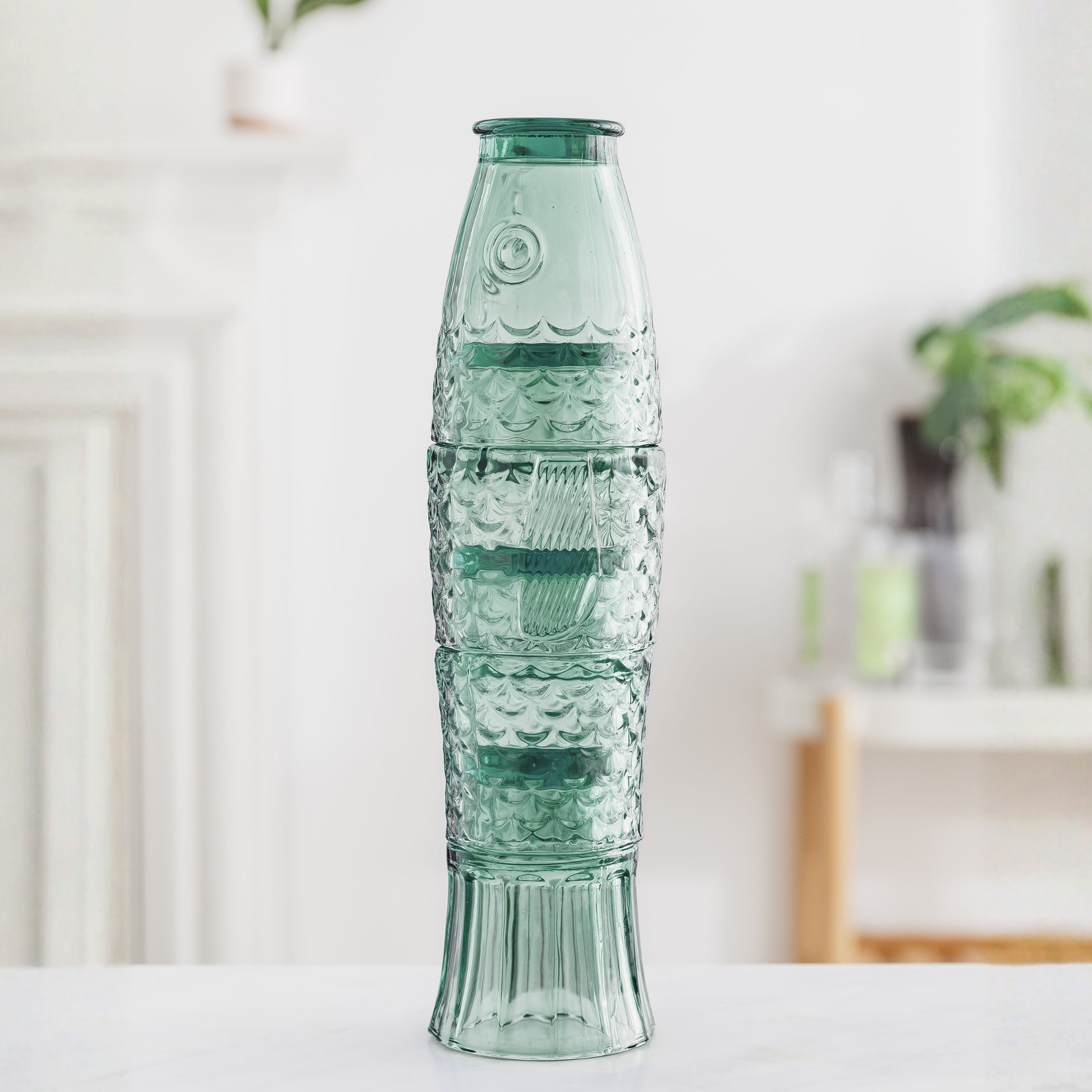 Green - Fish Stacking Drinking Glass - Set of 4 Glasses on a table