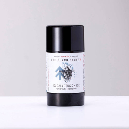 Image of The Black Stuff Natural Deodorant Eucalyptus on Ice scent sitting on a shelf with the lid on