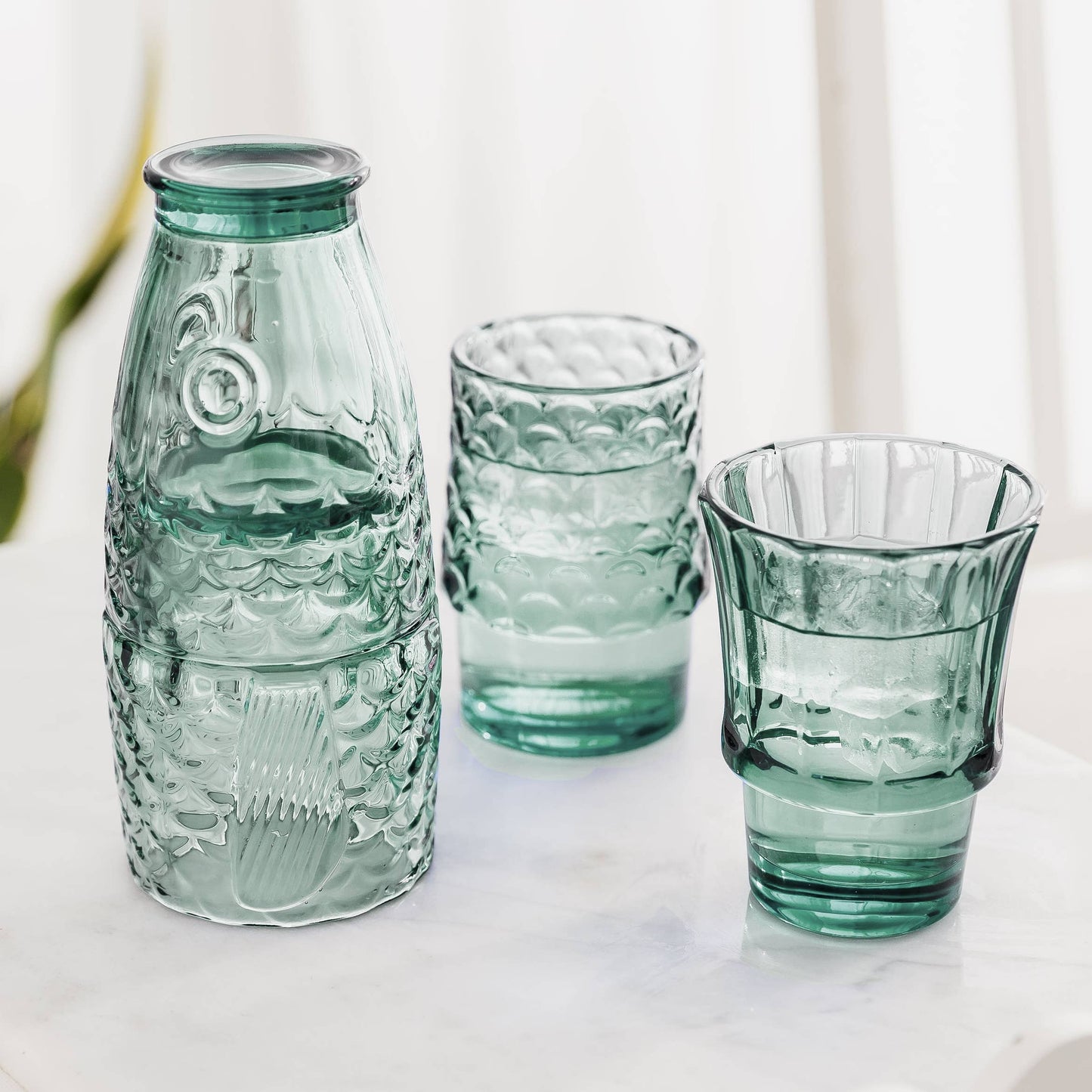 Green - Fish Stacking Drinking Glass open on a table