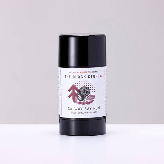 Image of The Black Stuff Natural Deodorant Galway Bay Rum scent sitting on a shelf with the lid on