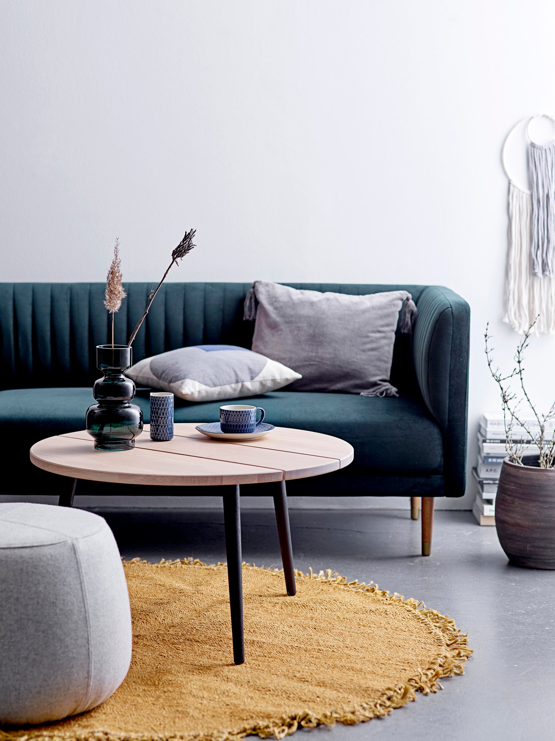 Bloomingville Johnson Green Glass Vase | Decorative Flower Vase UK sitting on a coffee table