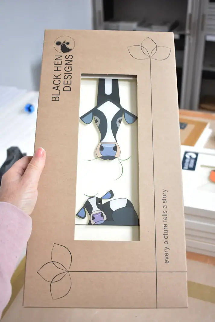 Rise & Shine. Image of cows in box