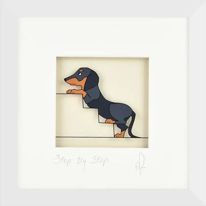 A framed image of a dashshund dog going up steps