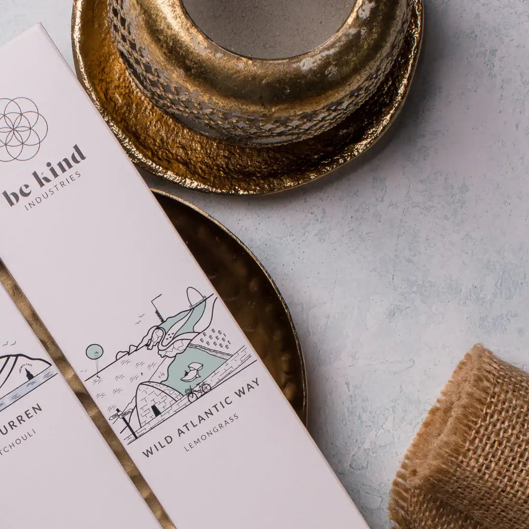 Product packaging with 'be kind industries' branding on a textured surface.